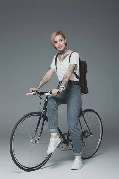 Beautiful Stylish Girl Tattoos Sitting Bicycle Looking Camera Isolated Grey — Stock Photo, Image