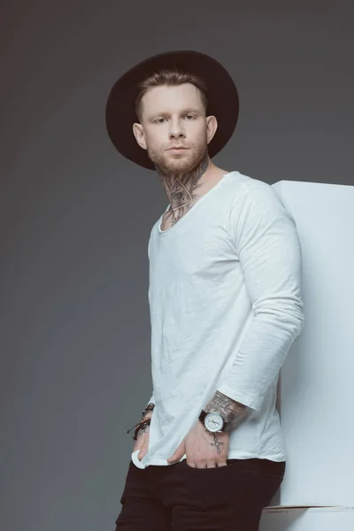 Stylish Young Tattooed Man Black Hat Standing Hands Pockets Looking — Stock Photo, Image