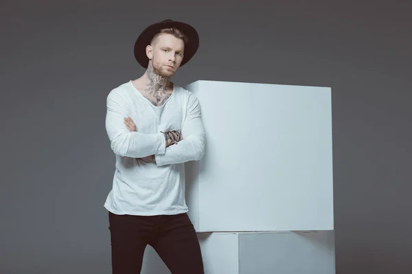 Stylish Young Tattooed Man Black Hat Standing Crossed Arms Looking — Stock Photo, Image