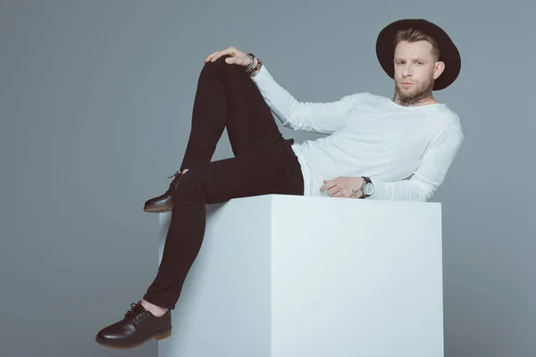 Fashionable Man Hat Posing White Cubes Isolated Grey — Stock Photo, Image