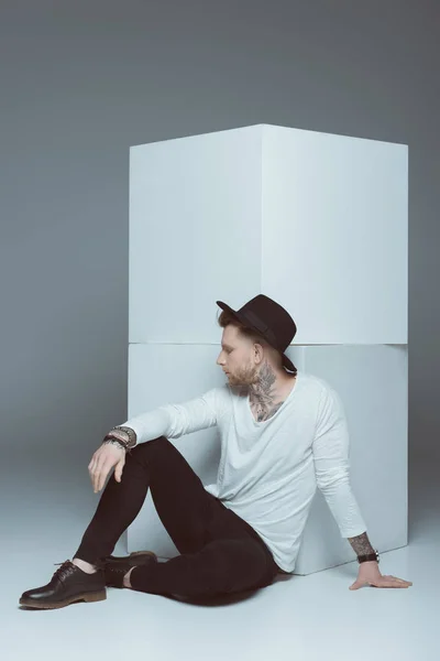 Stylish Man Hat Posing White Cubes Isolated Grey — Stock Photo, Image