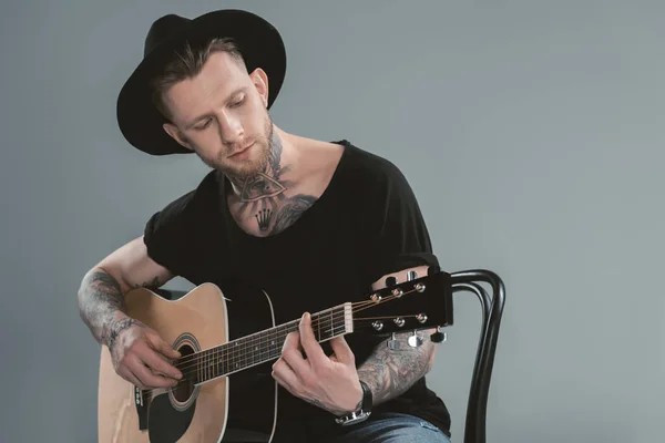 Handsome Tattooed Guitarist Black Hat Playing Acoustic Guitar Isolated Grey — Stock Photo, Image