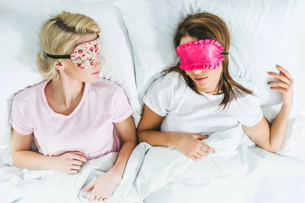 Top View Young Girls Sleeping Masks Bed — Stock Photo, Image