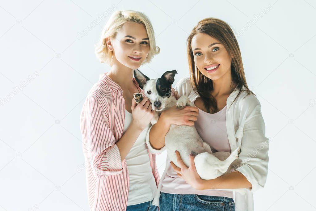 beautiful smiling girls with jack russell terrier dog, isolated on white