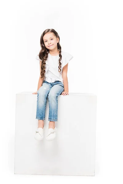 Smiling Kid Sitting Blank Cube Isolated White — Stock Photo, Image