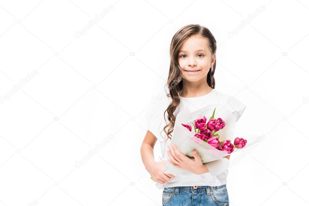 portrait of cute smiling child with bouquet of flowers in hands isolated on white, mothers day concept