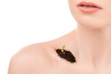 cropped view of girl with soil and sprout on collarbone, isolated on white clipart