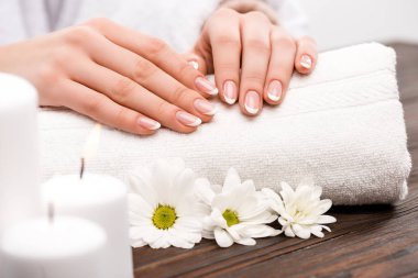cropped view of woman making medicine and spa procedure in beauty salon clipart
