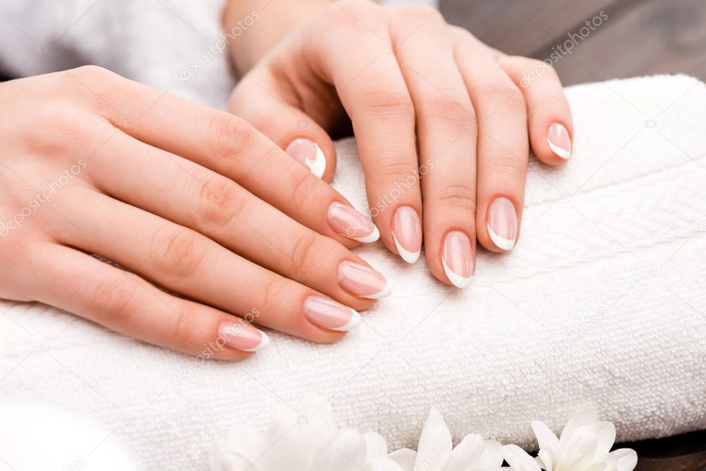 cropped view of woman making medicine in beauty salon, nail care concept