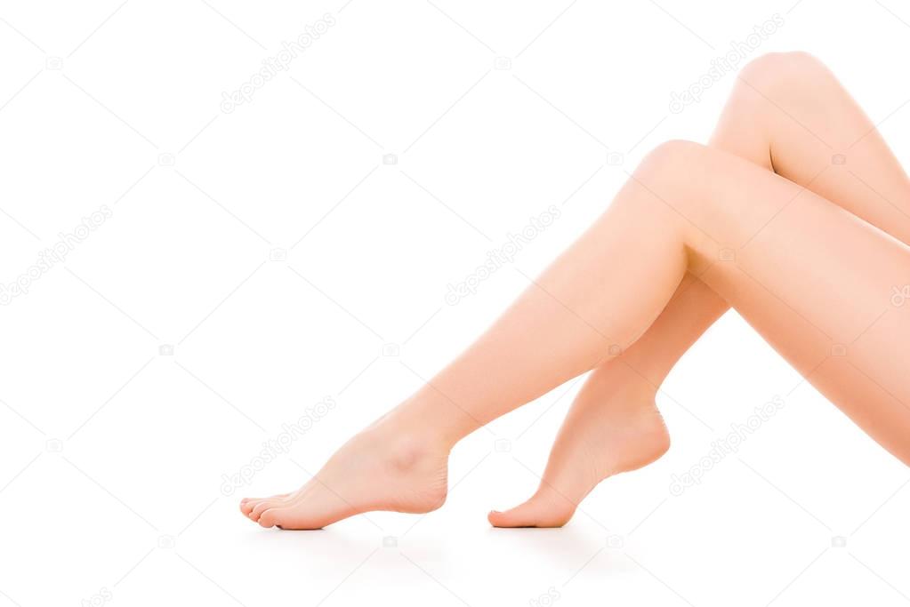 cropped view of woman with beautiful legs, isolated on white