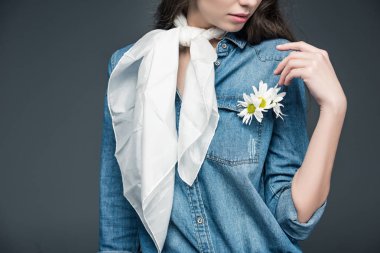 cropped view of girl in scarf and denim shirt with flowers, isolated on grey clipart