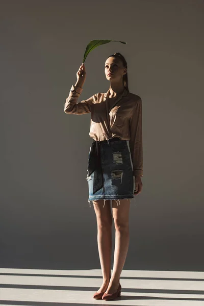 Fashionable Model Denim Skirt Blouse Holding Green Leaf — Stock Photo, Image
