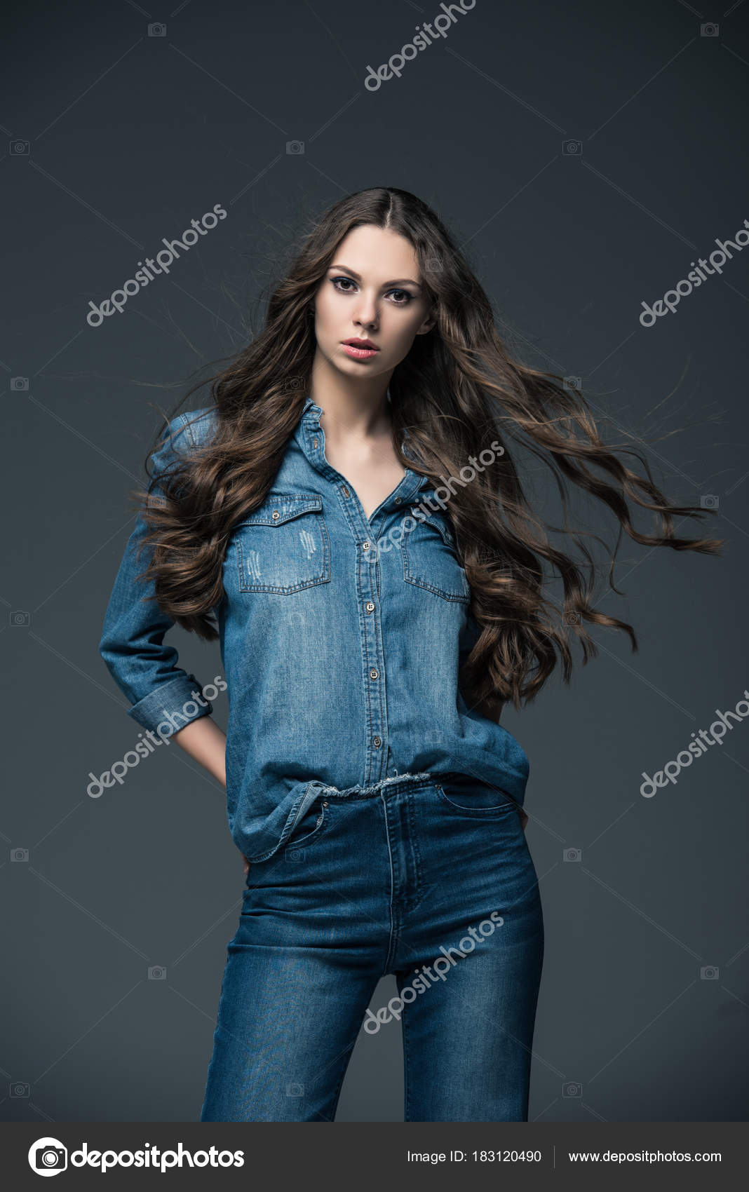 Beautiful little girl with long blonde hair poses in the studio Stock Photo  | Adobe Stock