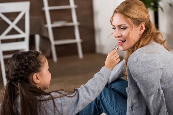 Cute Little Daughter Applying Lipstick Happy Mother Home — Stock Photo, Image