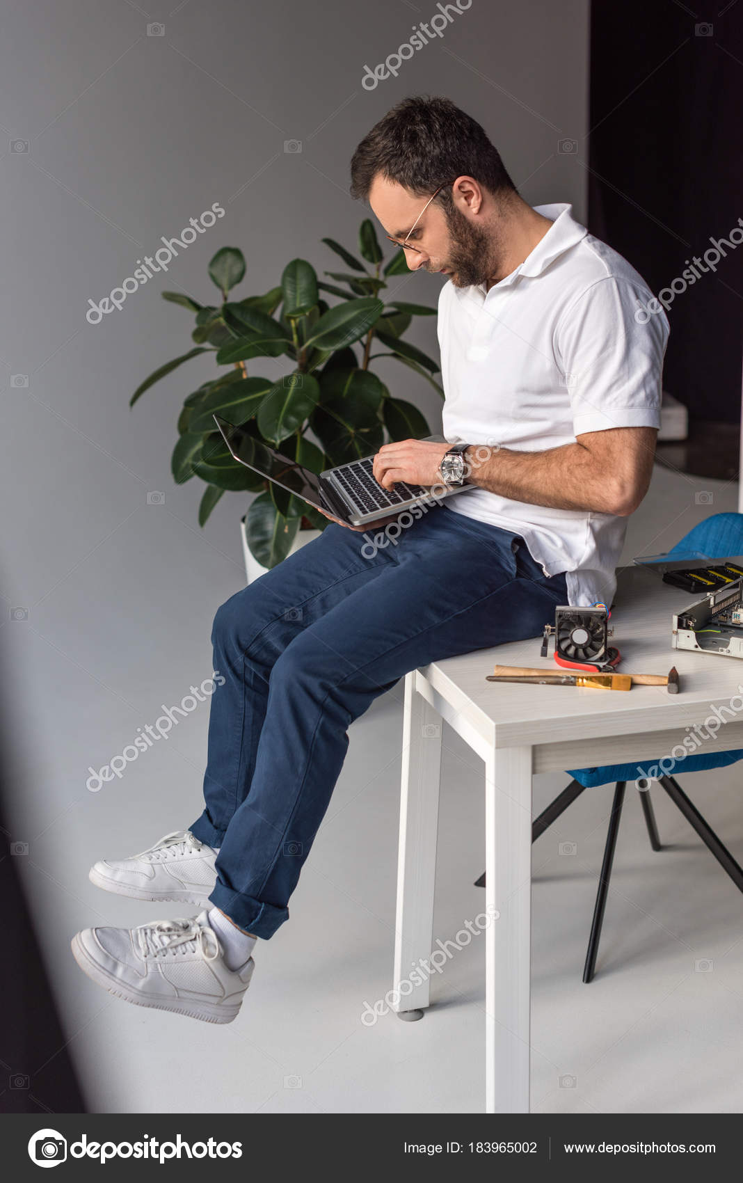 Man Sitting Table Using Laptop — Free Stock Photo © AllaSerebrina