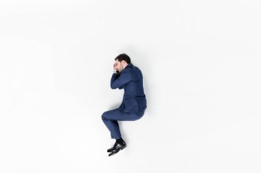genç işadamı beyaz izole takım elbise sleeping Üstten Görünüm