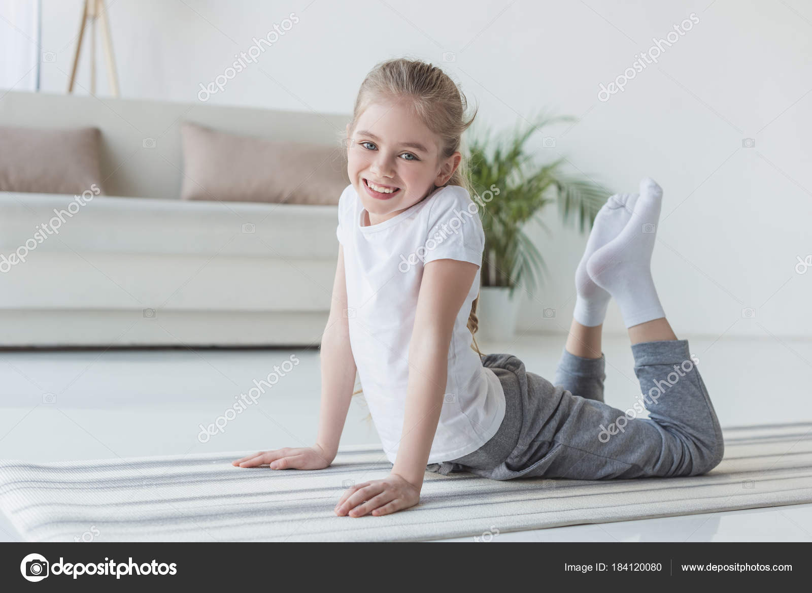 Happy Little Child Doing Backbend Yoga Mat Looking Camera Stock