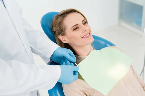 Doctor Fixing Female Patient Napkin Modern Dental Clinic — Stock Photo, Image