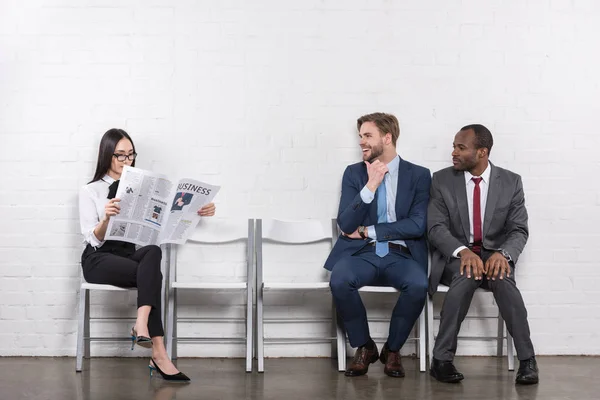 Multicultural Businessmen Looking Asian Businesswoman Newspaper While Waiting Job Interview — Stock Photo, Image