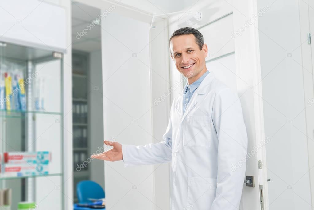 Doctor inviting patient to modern clinic