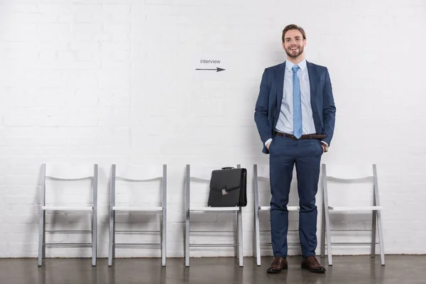 Smiling Caucasian Businessman Standing Empty Chairs Waiting Job Interview — Stock Photo, Image