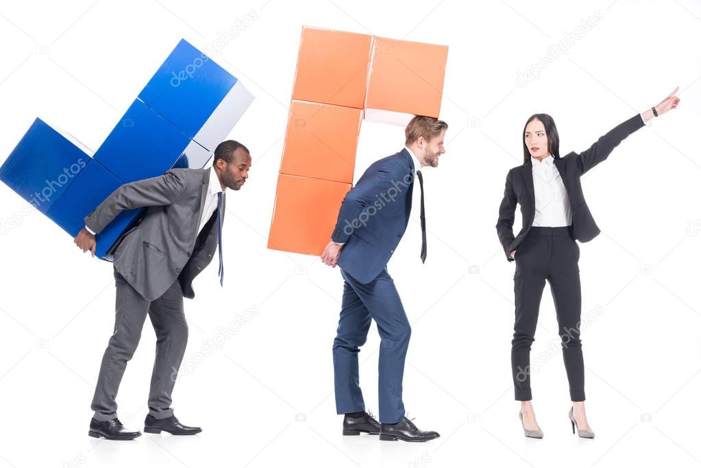 asian businesswoman leading multiethnic colleagues with colorful blocks isolated on white, leadership and business cooperation concept