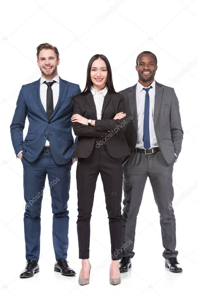 smiling multicultural young business people in suits isolated on white