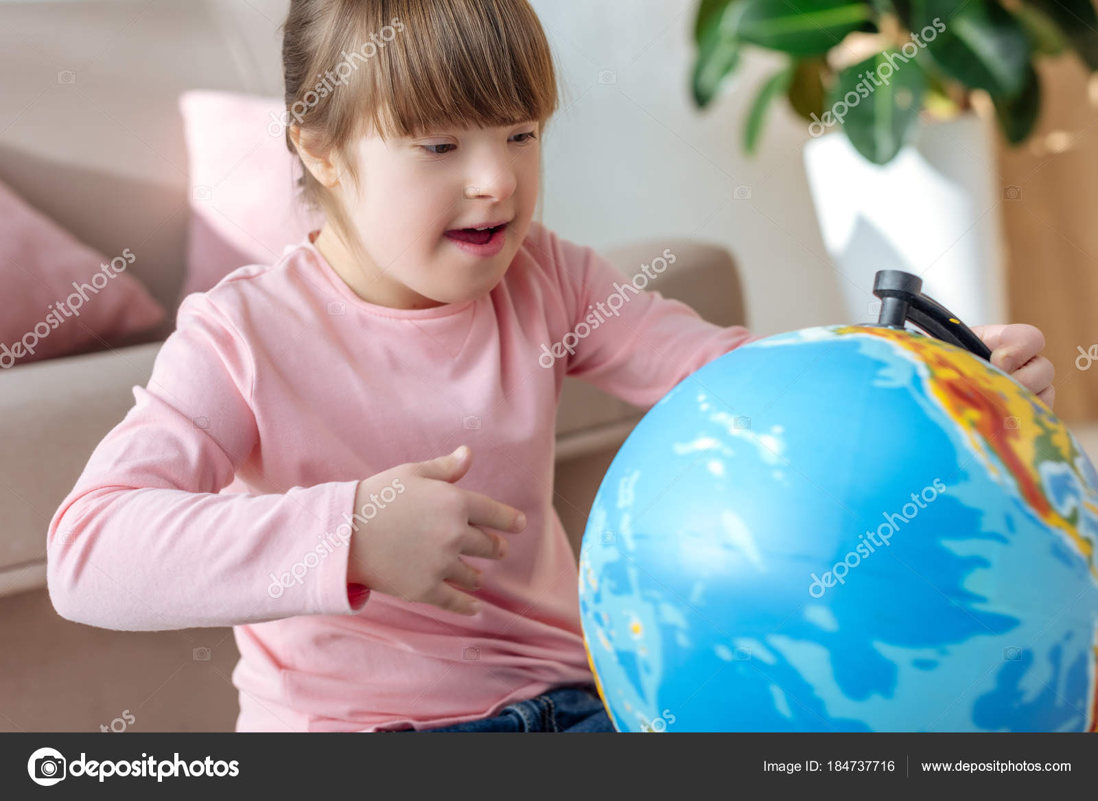 https://st3.depositphotos.com/12985790/18473/i/1600/depositphotos_184737716-stock-photo-child-syndrome-looking-globe.jpg
