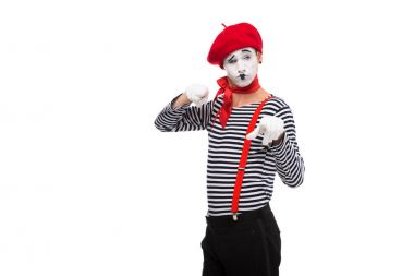 grimacing mime pointing on camera isolated on white clipart