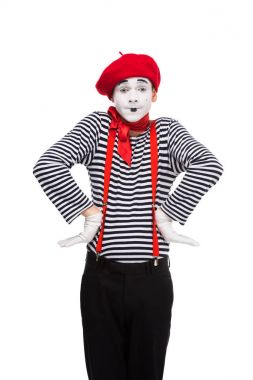 surprised mime standing with hands akimbo isolated on white clipart