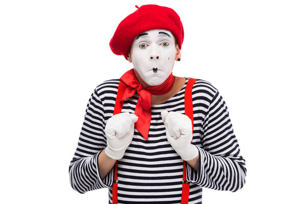 scared mime looking at camera isolated on white