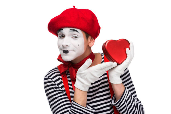 happy mime showing at heart shaped gift box isolated on white, st valentines day concept
