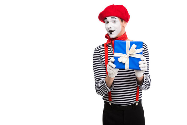 excited mime holding gift box isolated on white