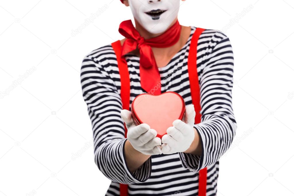 cropped image of mime holding heart shaped gift box isolated on white, st valentines day concept