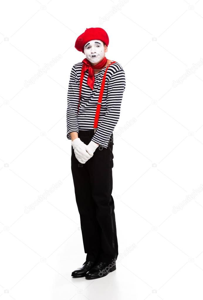 grimacing mime standing isolated on white