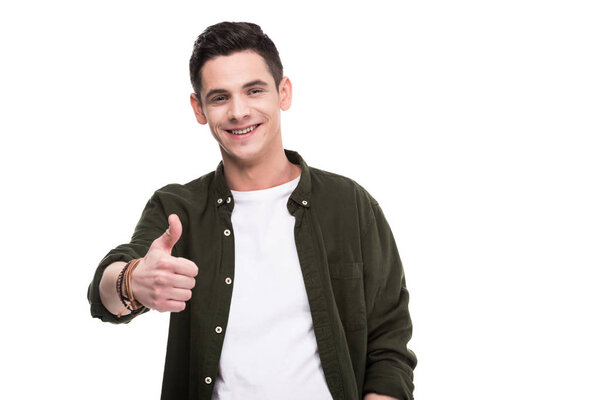 smiling man showing thumb up isolated on white