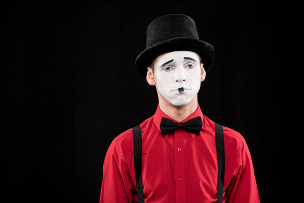 sad mime looking at camera isolated on black