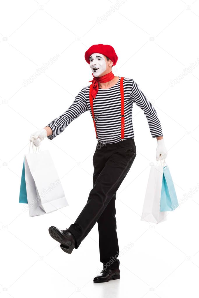 mime walking with shopping bags isolated on white