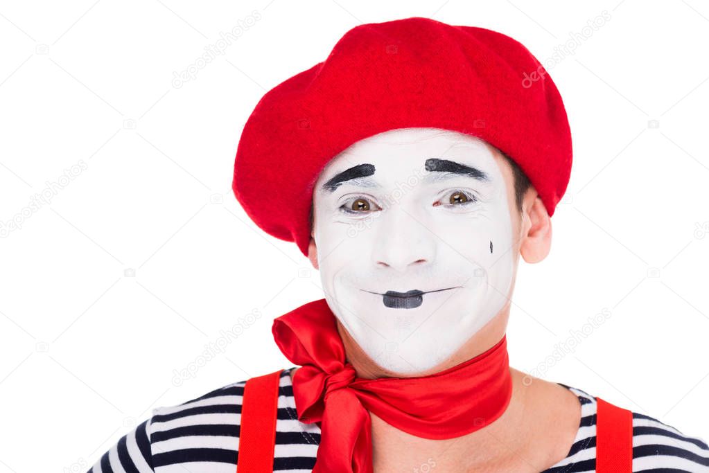 portrait of smiling mime looking at camera isolated on white