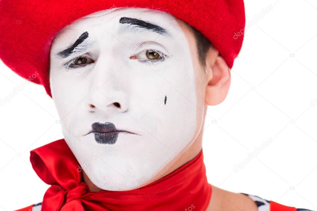 portrait of grimacing mime with makeup isolated on white