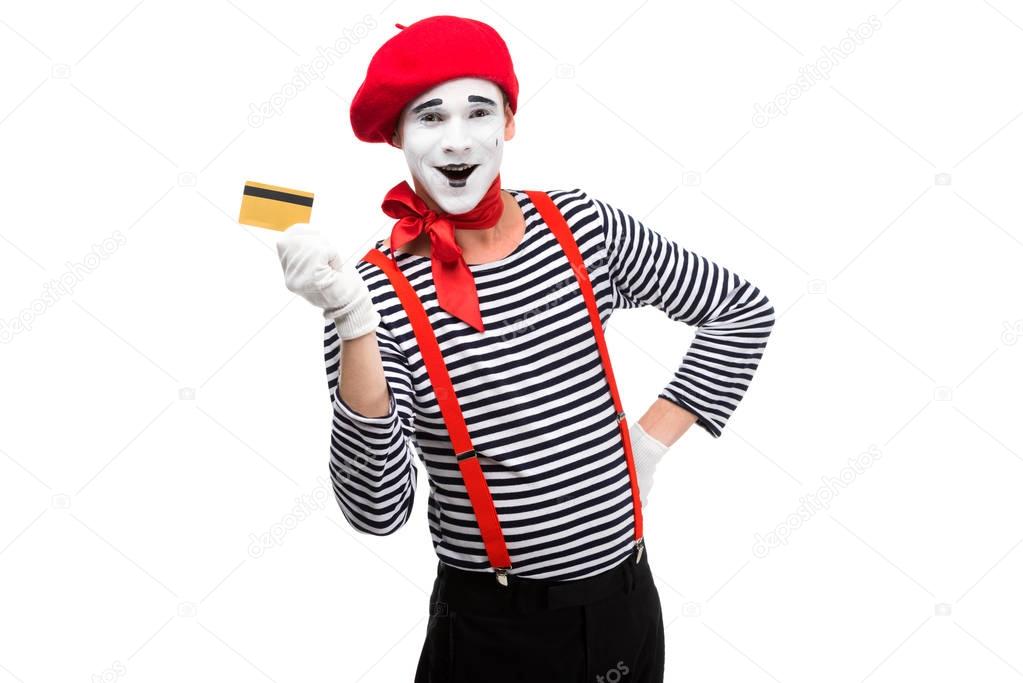 happy mime showing credit card isolated on white