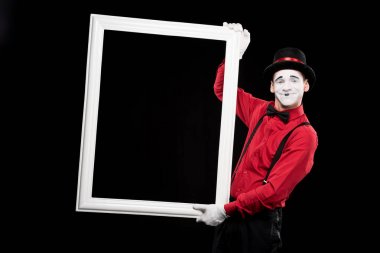 smiling mime holding frame isolated on black clipart