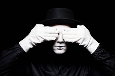 mime covering eyes isolated on black