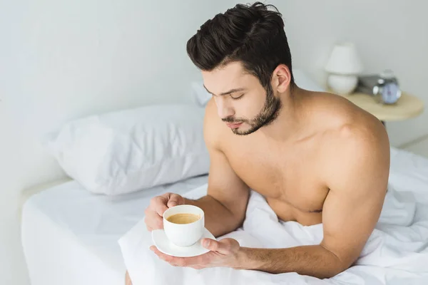 Handsome Bearded Man Holding Coffee Cup Bed Morning — Free Stock Photo