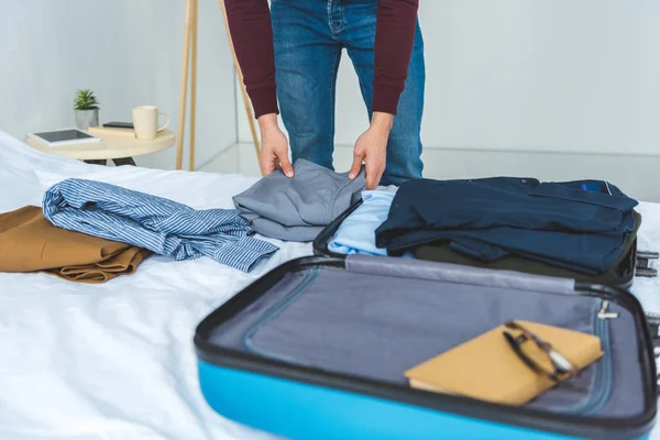 Cropped View Man Packing Clothes Travel Bag Bed — Stock Photo, Image