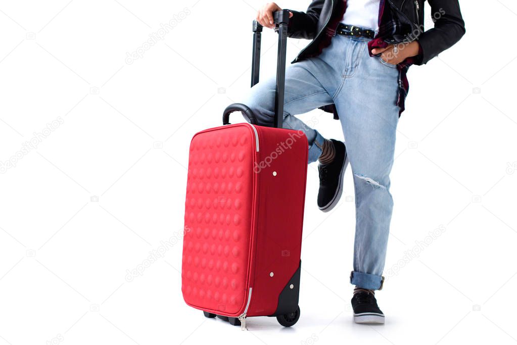 cropped shot of little child in stylish clothing with suitcase isolated on white