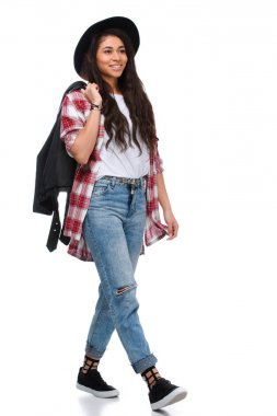 beautiful walking young woman in stylish plaid shirt and leather jacket isolated on white clipart