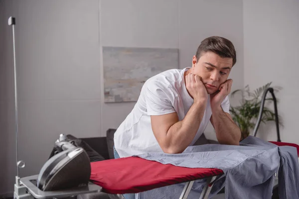 Pensive Handsome Man Resting Chin Hands Looking Iron Living Room — Free Stock Photo