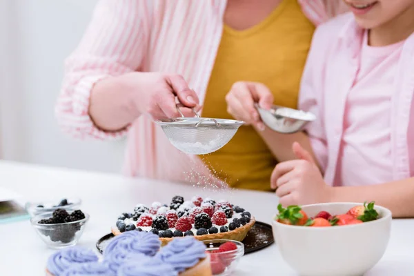 Cropped Shot Grandmother Little Granddaughter Pouring Sugar Powder Tart Berries — Stock Photo, Image