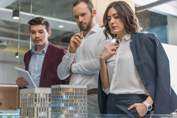 Team Thoughtful Architects Looking Miniature Town Model — Stock Photo, Image